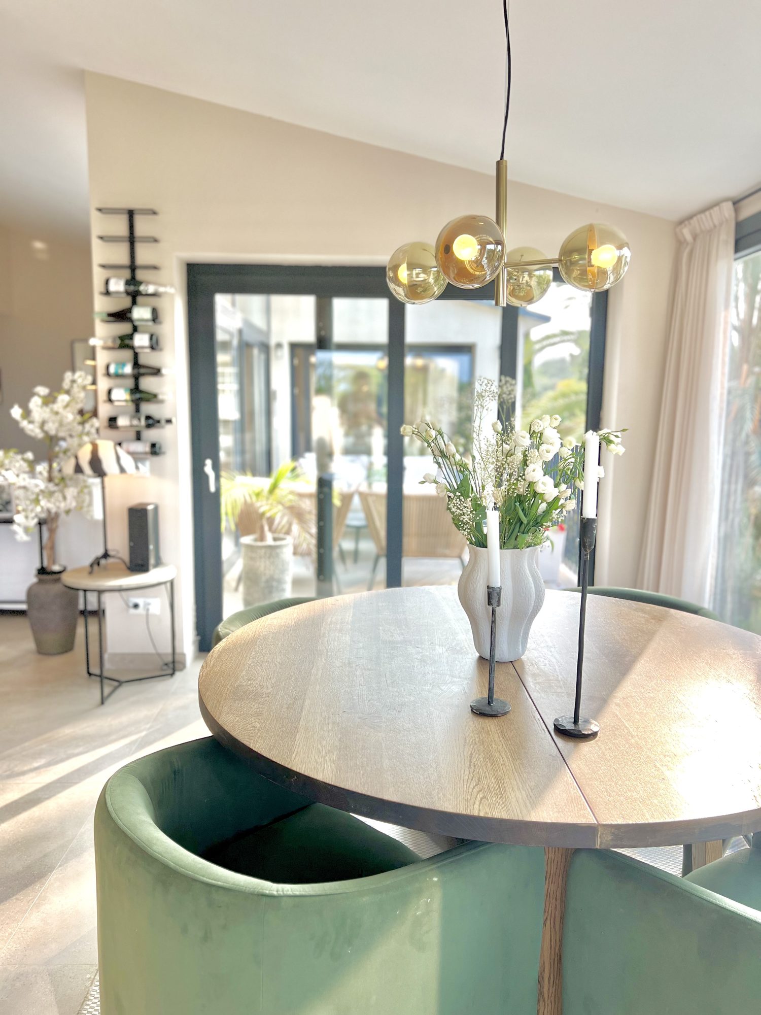 Ricmar — Dining — the table set beneath the window.